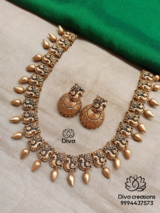 Peacock droplet terracotta jewellery